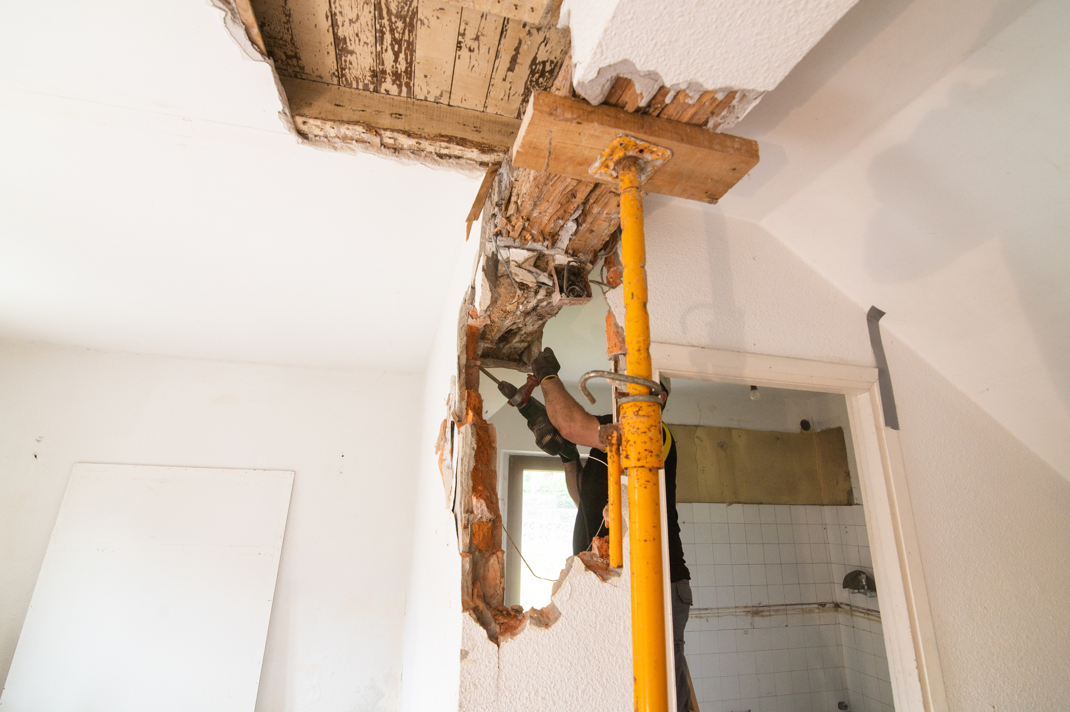 Knocking down a brick wall in a house